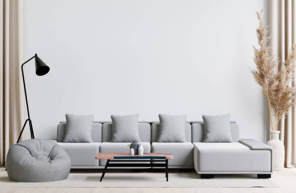 istock Contemporary living room with a grey sofa, bean bag, and coffee table. 3d rendering. 1498793489