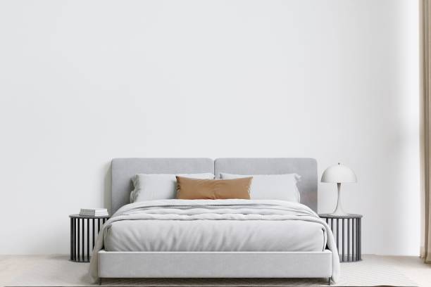 istock Contemporary bedroom with a soft bed, and table lamp. 3d rendering. 1498793493