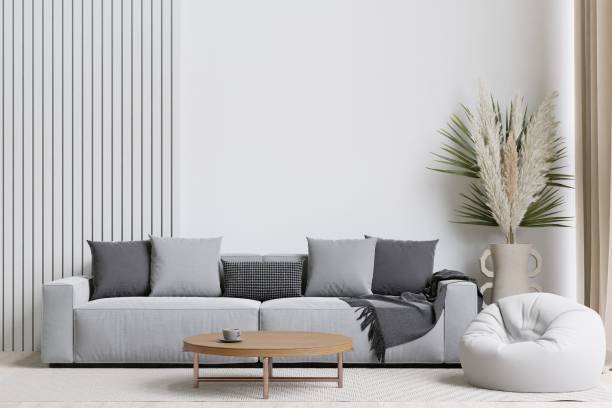 istock Contemporary living room with a grey sofa, bean bag, and decorative plants. 3d rendering. 1498793514