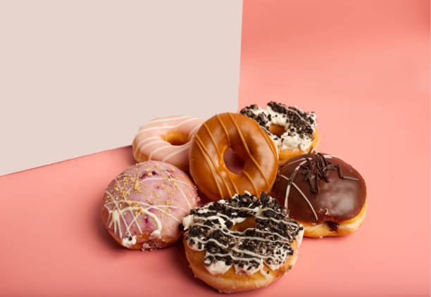 a variety of donuts with a white box