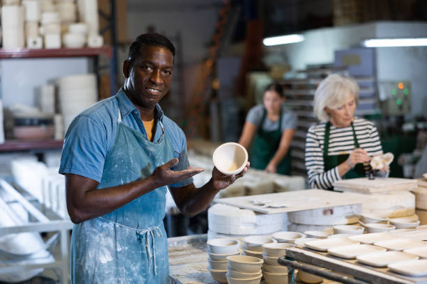 istock Portrait of positive man potter in workshop 1498795613