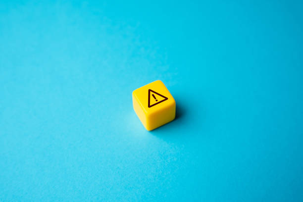 Warning sign on yellow block.