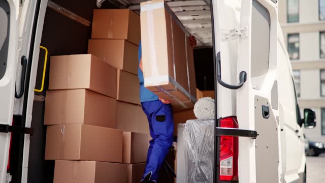 Truck Movers Loading Van Carrying Boxes