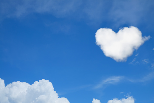 White clouds formed to heart shape use for love concepts and valentine background