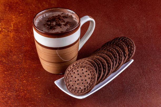 istock Cup of milk with cocoa and chocolate biscuits 1498807212