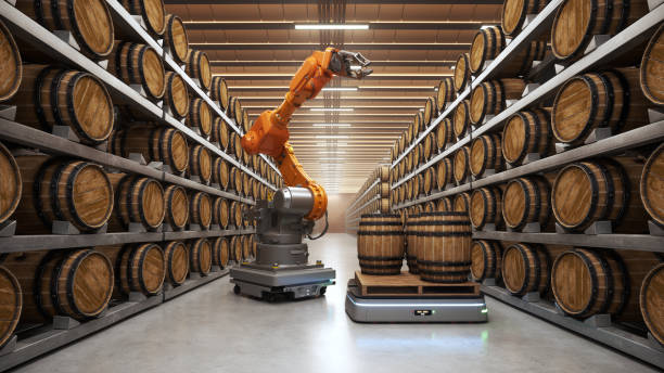 Automated Robot Carriers And Robotic Arm In Wine Cellar Automation with AGV (Automated Guided Vehicles) and robotic arm in a modern wine cellar. wine shipping stock pictures, royalty-free photos & images
