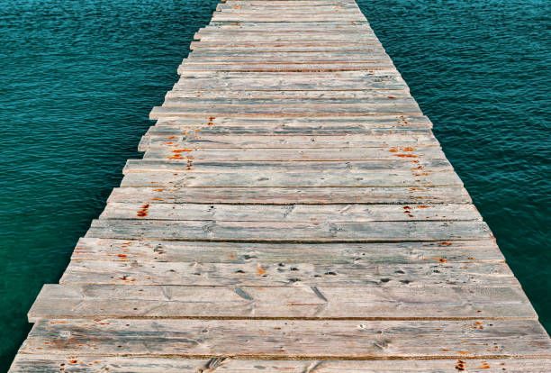 Wooden pier floor . Footpath over the sea
