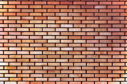 Red yellow beige taupe tan fine brick wall texture background, large detailed horizontal textured pattern copy space