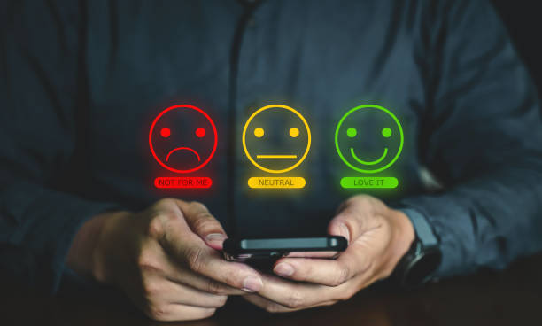 istock Customer Experience Concept,  Business people holding the smartphone with a checked box on Excellent Face and Rating for a satisfaction survey. 1498817734