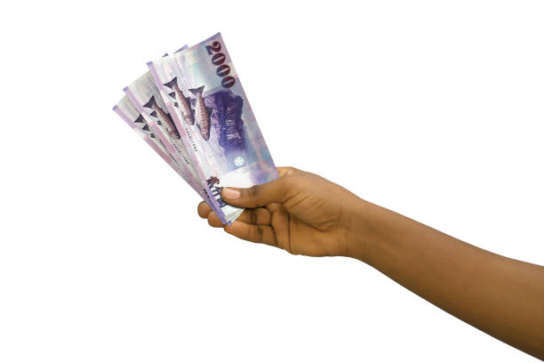 istock Fair hand holding 3D rendered 2000 New Taiwanese dollar notes isolated on white background 1498820183