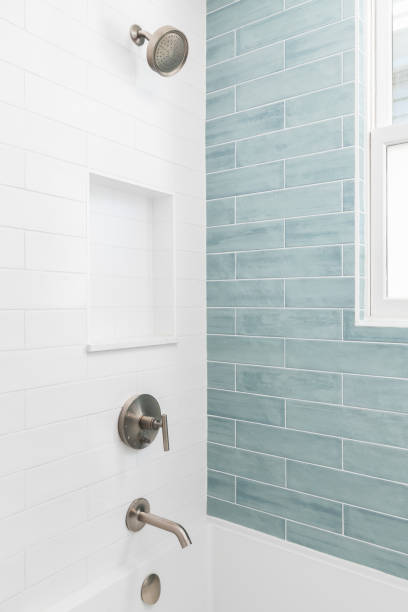 istock A shower with white and blue subway tiles. 1498821325
