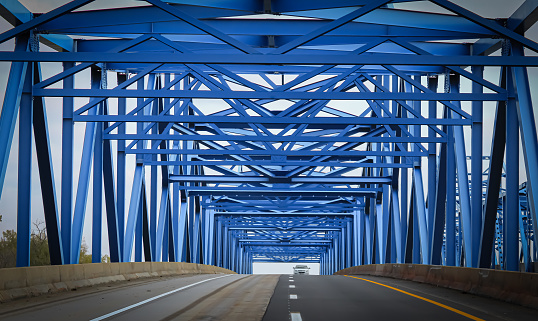A blue bridge crossing into downtown Omaha, Nebraska