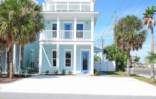 A light blue beach house on a sunny morning in Panama City, Florida