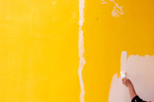 istock Grunge of yellow wall background texture. 1498824147