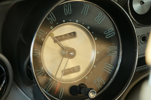 Close-up of a speedometer from a classic/vintage car