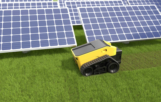istock The automatic lawn mower is mowing the grass at the solar panel. 1498842730