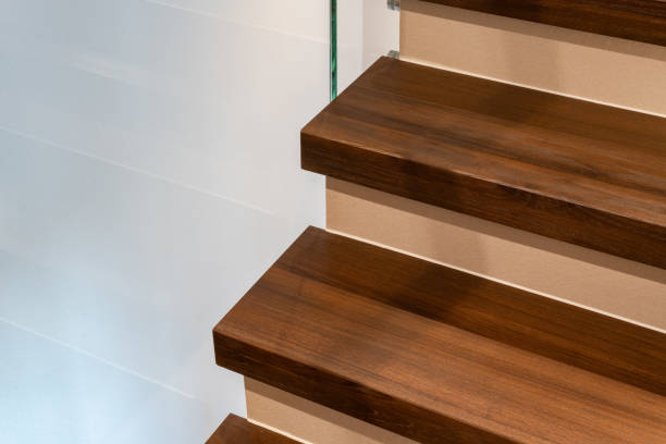 istock wooden modern stairs and glass railing 1498844234