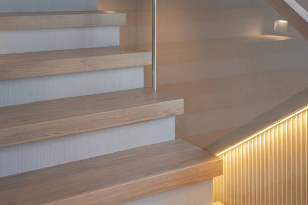 istock wooden modern stairs and glass railing 1498844276