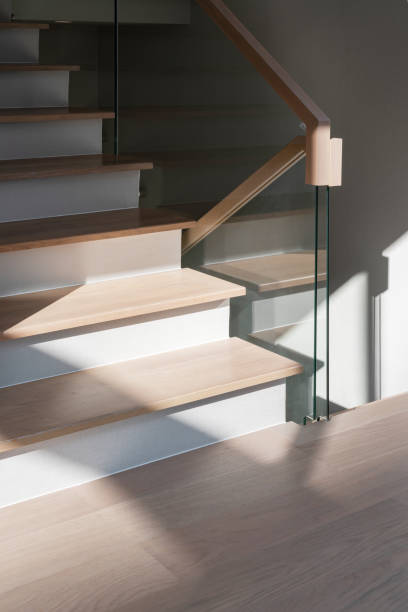 istock wooden modern stairs and glass railing 1498844312