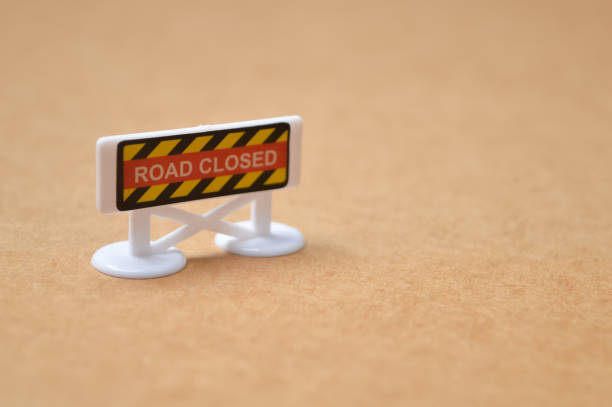 istock Barricades with a board saying Road Closed. Copy space for the text. 1498845692