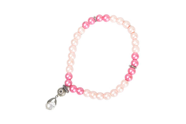 Pearls bracelet necklace isolated on a blue background