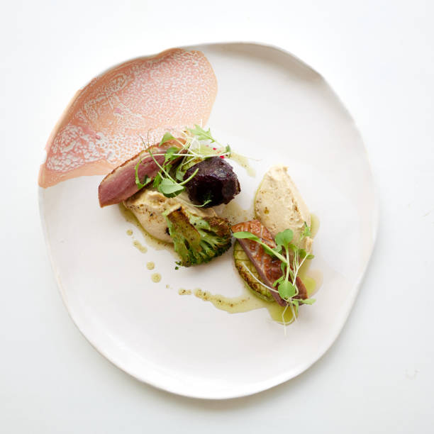 istock Smoked duck breast with hummus, beetroot and broccolli 1498849270