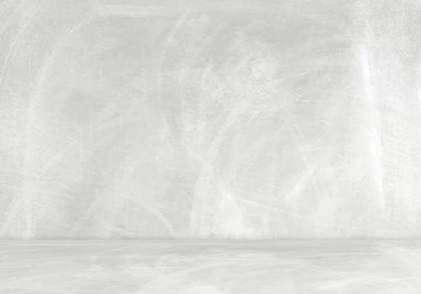 istock background and concrete backdrop and cement shelf showing products in black and gray , empty studio interior and with empty messages background. 1498851821
