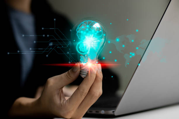 istock Business people holding light bulb. Creative idea smart brain AI. Technology background concept. 1498855493