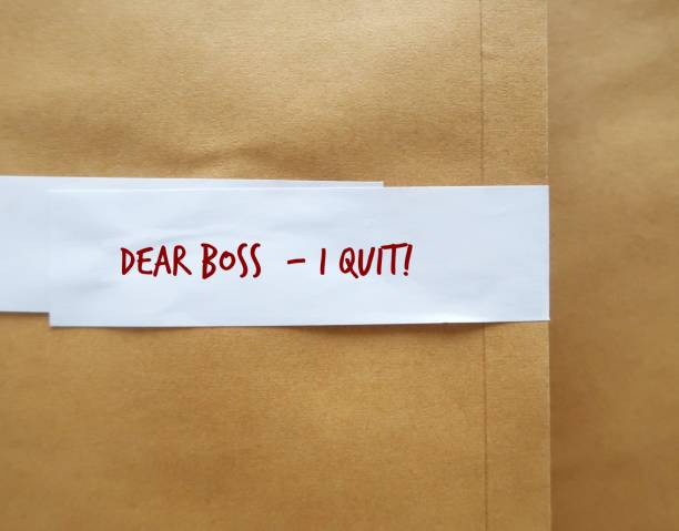 istock Office envelope pack with text written DEAR BOSS I QUIT, concept of decision making to quit job, leave employment, quit being full time workers, employees hates their jobs and decide to resign 1498861612