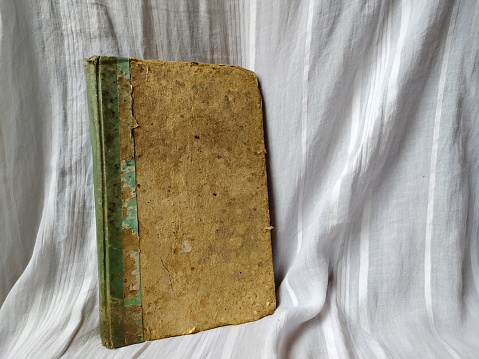 A photo of An old brown book with a vintage texture