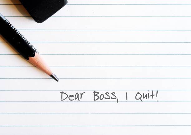 istock Pencil on lined note sheet paper with handwritten DEAR BOSS I QUIT - concept of making decision to resign from full time corporate work, leave horrible workplace or boss, quit job 1498862290