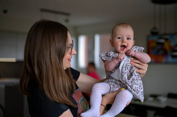 istock Mother holding baby girl 1498862492
