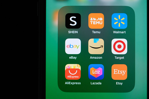 Shanghai,China-June 13st 2023: Amazon, eBay, SHEIN, Temu, Walmart, AliExpress, Lazada, Target and Etsy app icon on screen. Assorted e-commerce company and brand logo