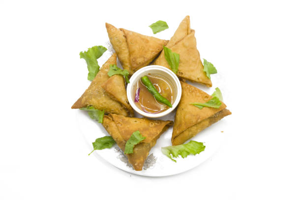 istock samosas and vegetables isolated on wooden background 1498870629