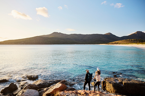 Clear, pure air and water. Morning views with happy young family at Wineglass Bay, part of the beautiful Freycinet National Park.