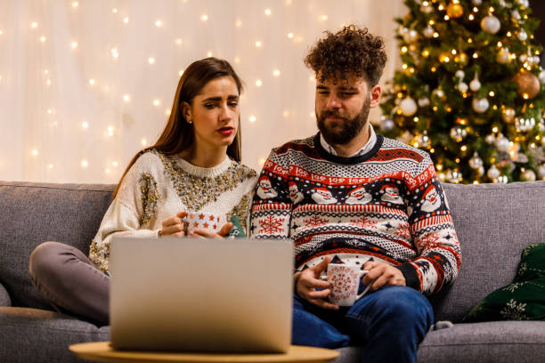 istock Young couple watching and discussing a documentary movie they are watching 1498871654