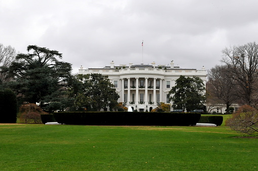 The Front Lawn of the White House with American Flag in Washington, DC.