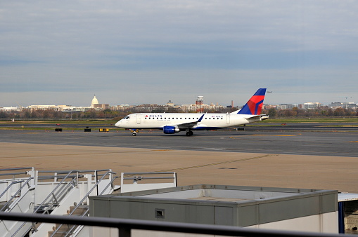 Washing D.C. USA- November 29, 2011: An ERJ-170 series airplane of Delta Airlines is taxing in Ronald Reagan Washington National Airport.