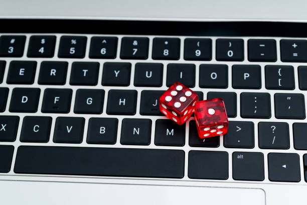 istock Red dices on laptop keyboard 1498875866