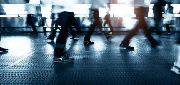 istock Blurred businessmen walking on footbridge 1498876318