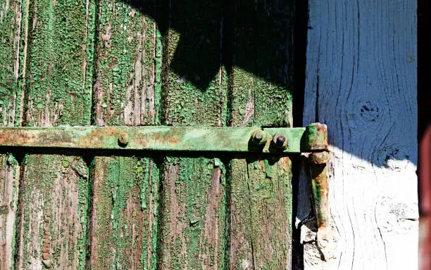 part of an old door with hinges