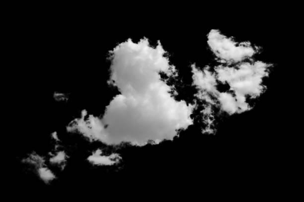 istock white fluffy clouds standing out against a black background and a blue sky 1498877373
