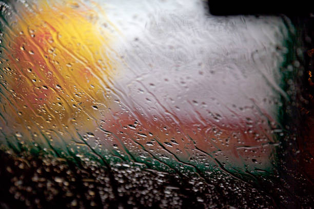 istock rain and water on the car window at night 1498877680