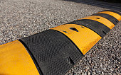 black and yellow speed bumps