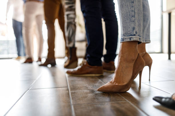 istock Group of unrecognizable people standing in line and waiting 1498878172