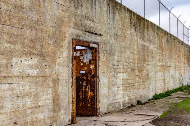 Photo of Gate of the maximum security federal prison of Alcatraz located on an island in the middle of the bay of San Francisco, California, USA. Prison in the ocean full of towers and guards.