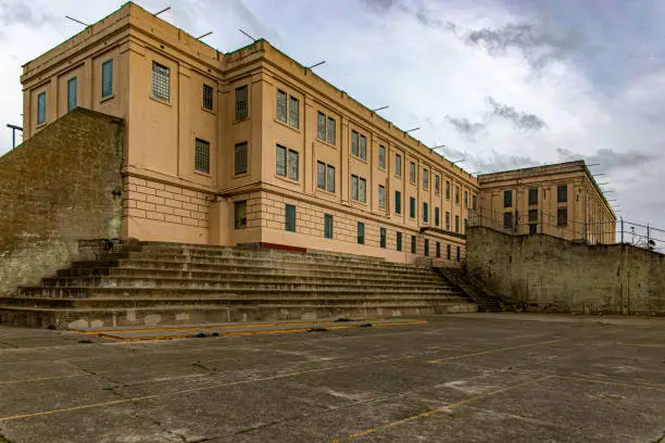 Photo of The famous maximum security federal prison of Alcatraz, located on an island in the middle of San Francisco Bay, California, USA. Prison in the ocean full of towers and guards.