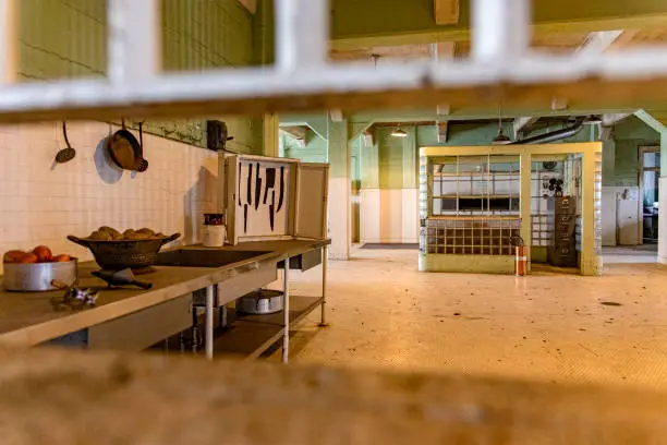 Photo of Kitchen with its security checkpoint of the maximum security federal prison of Alcatraz, located on an island in the middle of the bay of San Francisco, California, USA.