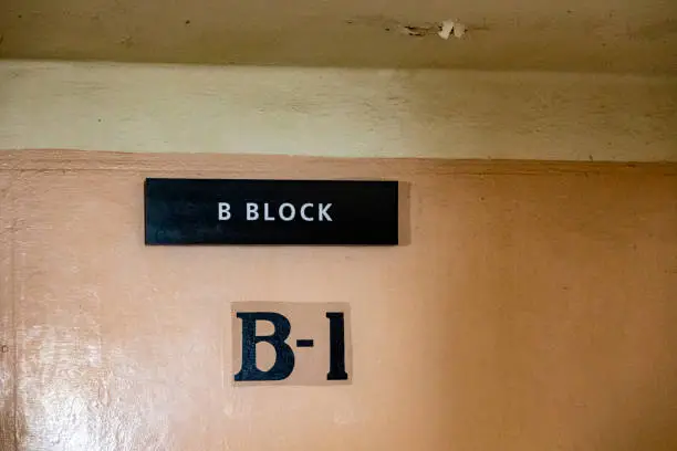 Photo of Sign of block b1 of the maximum security federal prison of Alcatraz, located on an island in the middle of the San Francisco Bay, California, USA.