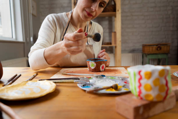 istock Woman painting a pottery 1498879364